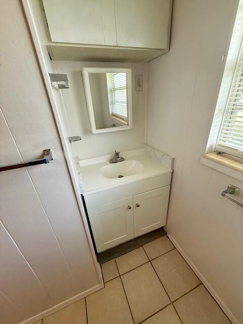 594 Florosa Court Mary Esther, FL 32569 - Photo 11 of 15 a room with a sink a window and a mirror