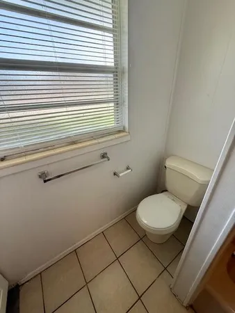 a bathroom with a toilet and a sink