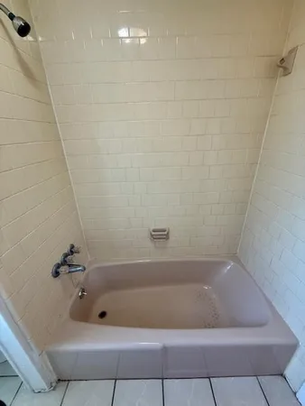 a bath tub sitting in a bathroom