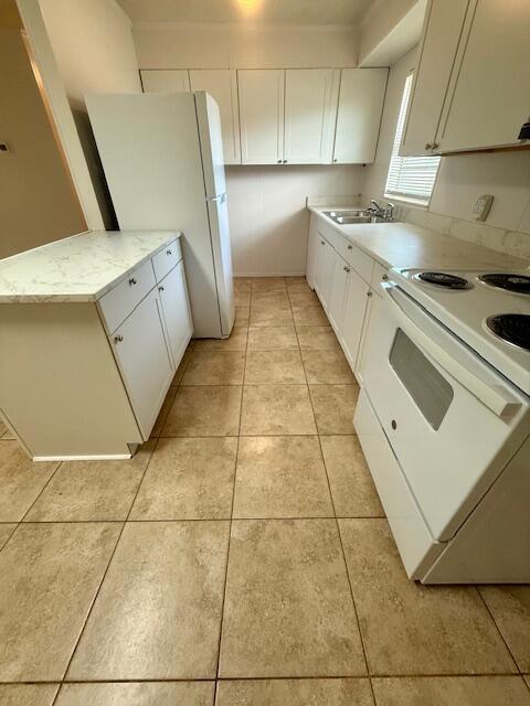 594 Florosa Court Mary Esther, FL 32569 - Photo 5 of 15 a kitchen with a sink a stove and refrigerator