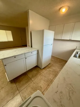 a view of a kitchen with a sink
