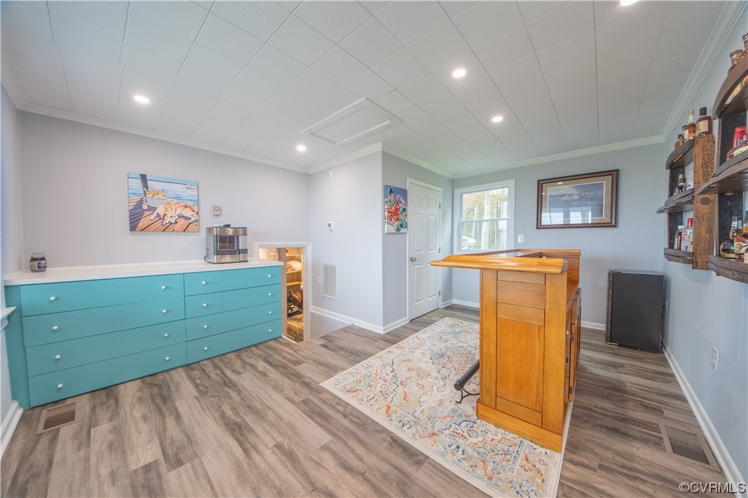 215 Riverside Drive Deltaville, VA 23043 - Photo 13 of 49 a bed room with a bed and a mirror