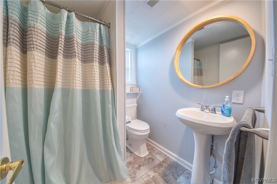 215 Riverside Drive Deltaville, VA 23043 - Photo 15 of 49 a bathroom with a sink and a mirror