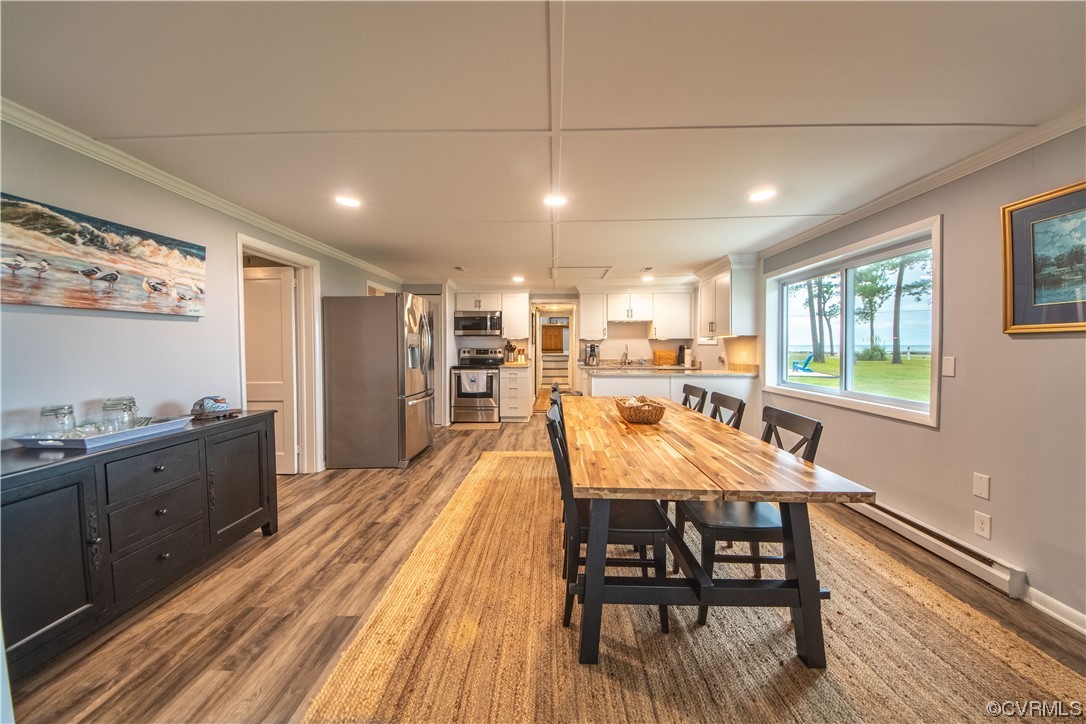 215 Riverside Drive Deltaville, VA 23043 - Photo 23 of 49 a view of a dining room with furniture window and wooden floor