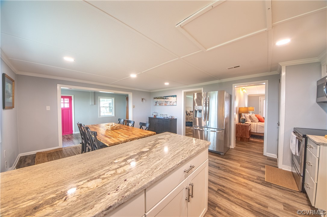 215 Riverside Drive Deltaville, VA 23043 - Photo 24 of 49 a bedroom with a bed and a large mirror on the dresser