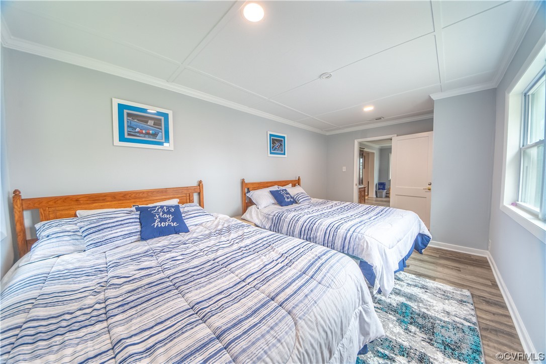 215 Riverside Drive Deltaville, VA 23043 - Photo 30 of 49 a bedroom with two beds and a window