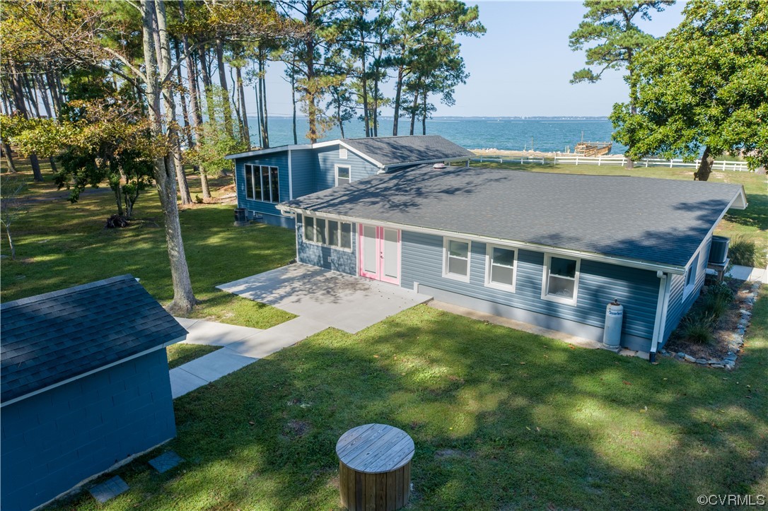 215 Riverside Drive Deltaville, VA 23043 - Photo 38 of 49 a aerial view of a house with a yard table and chairs