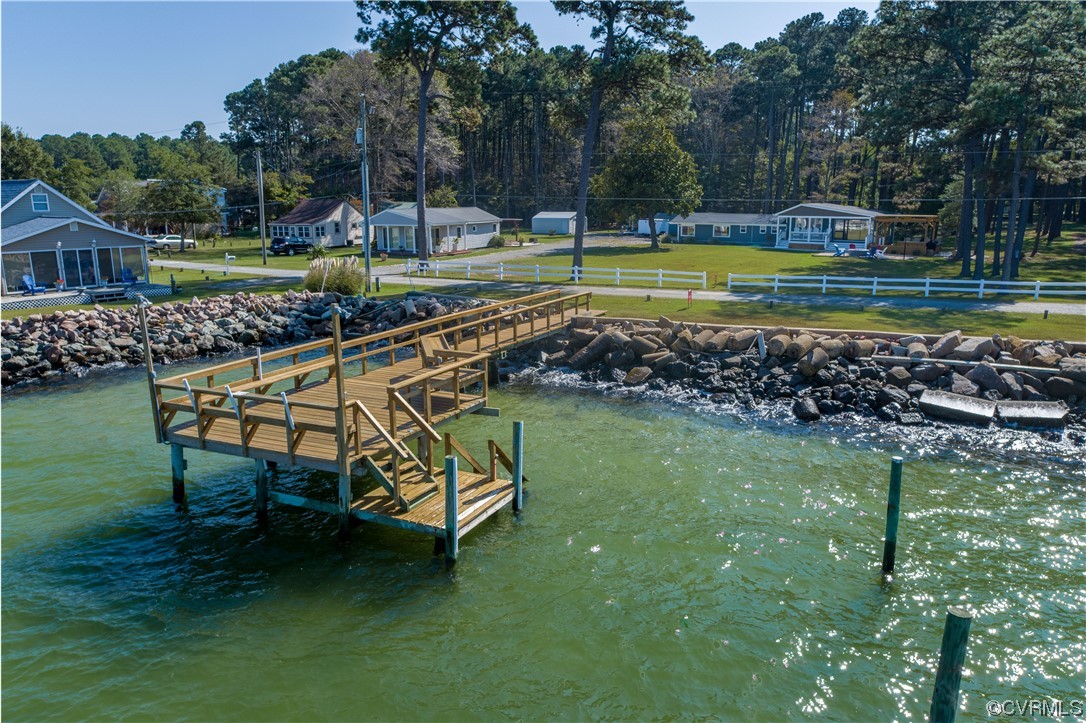215 Riverside Drive Deltaville, VA 23043 - Photo 41 of 49 a view of a house with a yard porch and sitting area