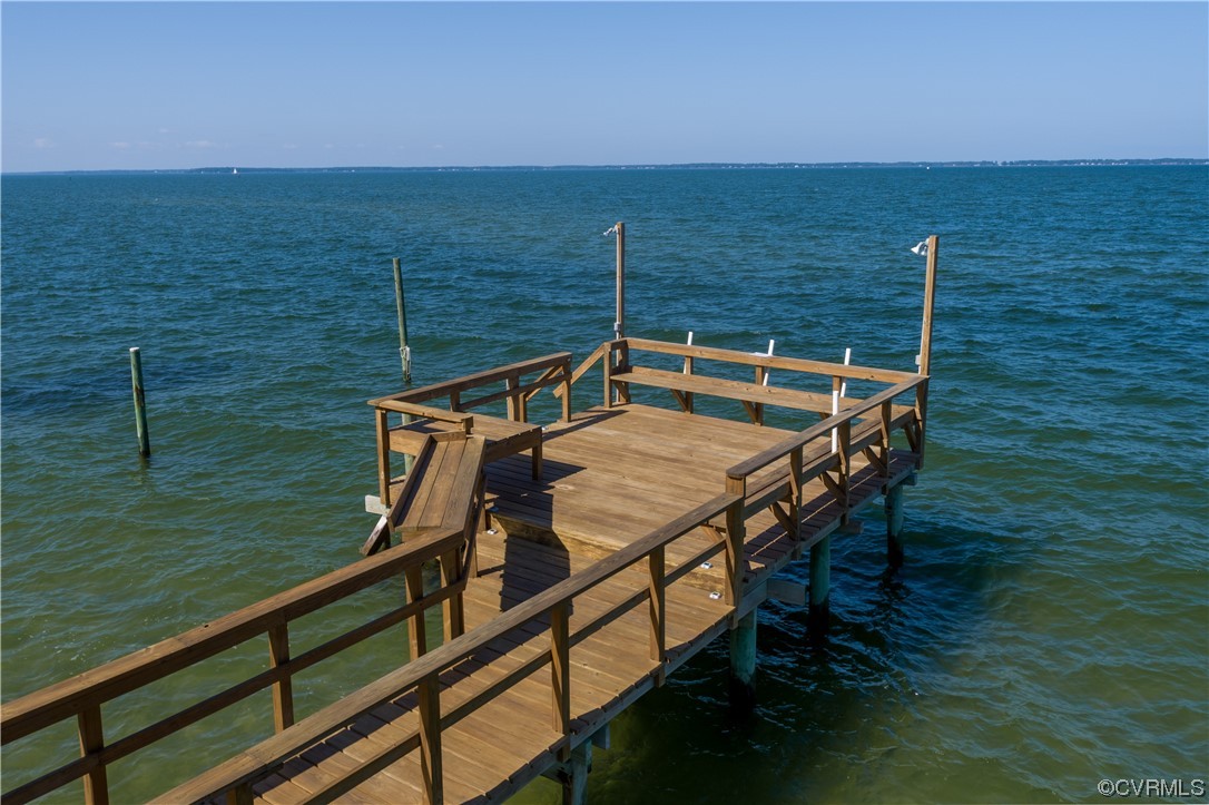 215 Riverside Drive Deltaville, VA 23043 - Photo 42 of 49 a view of a balcony with two chairs