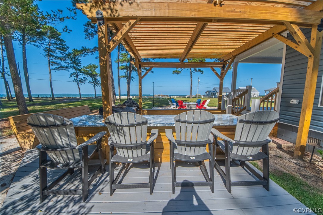 215 Riverside Drive Deltaville, VA 23043 - Photo 5 of 49 a patio with a table and chairs