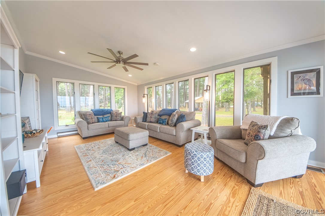215 Riverside Drive Deltaville, VA 23043 - Photo 8 of 49 a living room with furniture and a large window