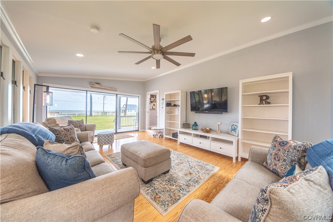 215 Riverside Drive Deltaville, VA 23043 - Photo 9 of 49 a living room with furniture and a flat screen tv