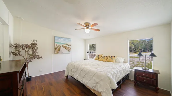 a bedroom with a bed and a table in it