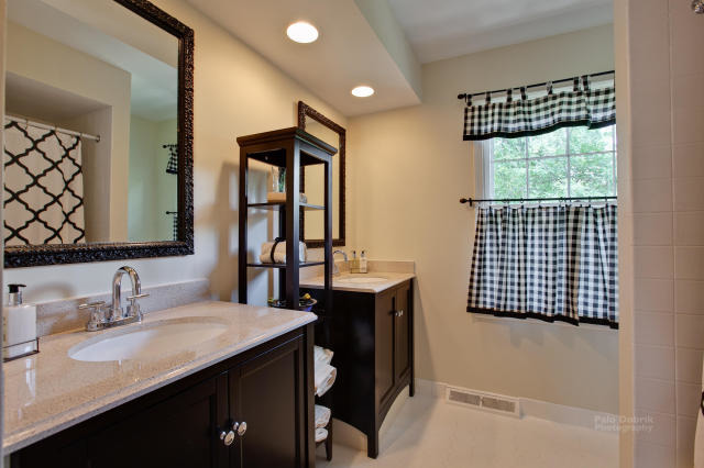 92 Old Mill Court Barrington, IL 60010 - Photo 14 of 25 a bathroom with a sink and a mirror