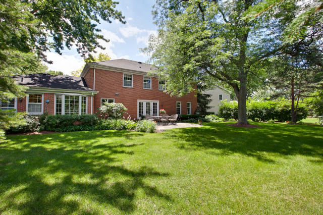 92 Old Mill Court Barrington, IL 60010 - Photo 22 of 25 a front view of a house with a garden