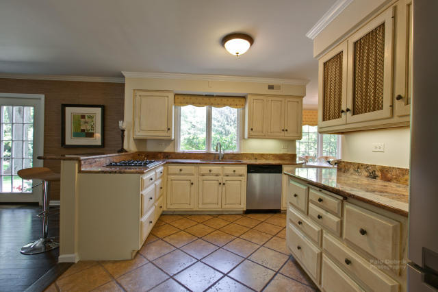 92 Old Mill Court Barrington, IL 60010 - Photo 5 of 25 a kitchen with sink cabinets and window