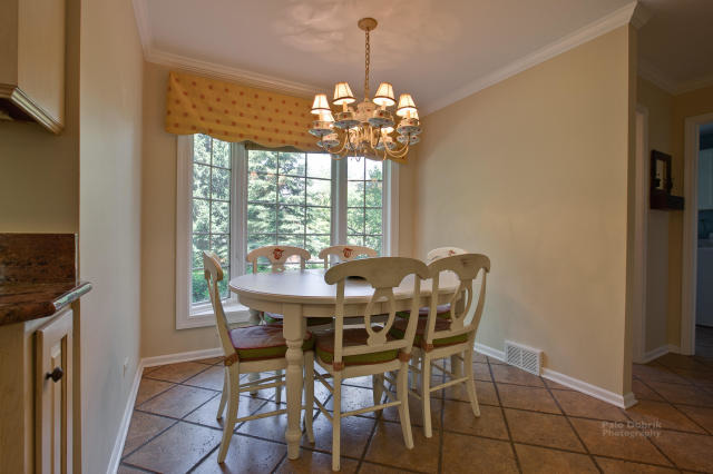 92 Old Mill Court Barrington, IL 60010 - Photo 7 of 25 a view of a dining room with furniture and window