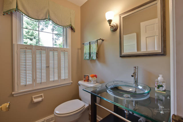 92 Old Mill Court Barrington, IL 60010 - Photo 9 of 25 a bathroom with a toilet a sink and a mirror