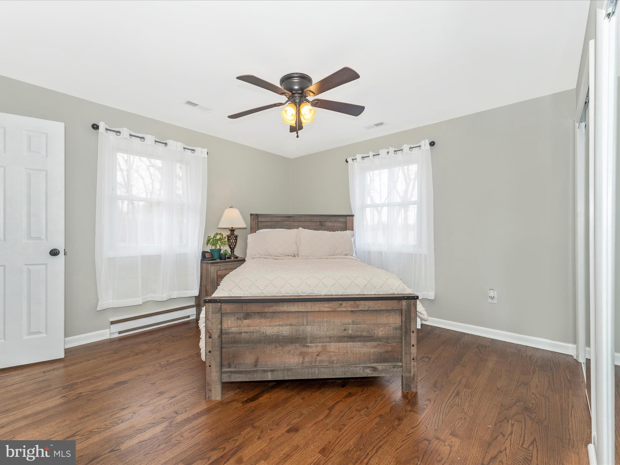4328 Dover Drive Frederick, MD 21703 - Photo 17 of 54 a bedroom with a bed and wooden floor