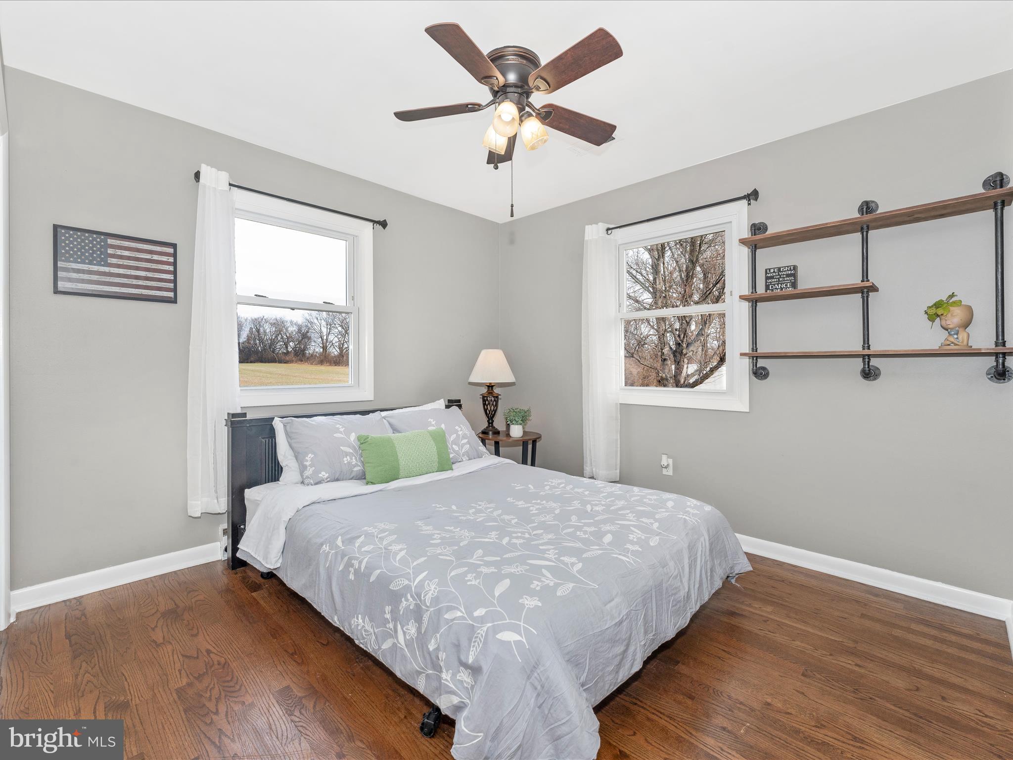 4328 Dover Drive Frederick, MD 21703 - Photo 20 of 54 a bedroom with a bed and a chandelier