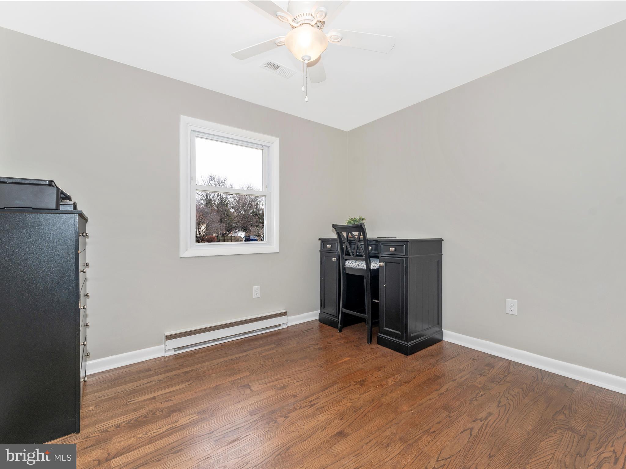 4328 Dover Drive Frederick, MD 21703 - Photo 22 of 54 a view of empty room with wooden floor and fan