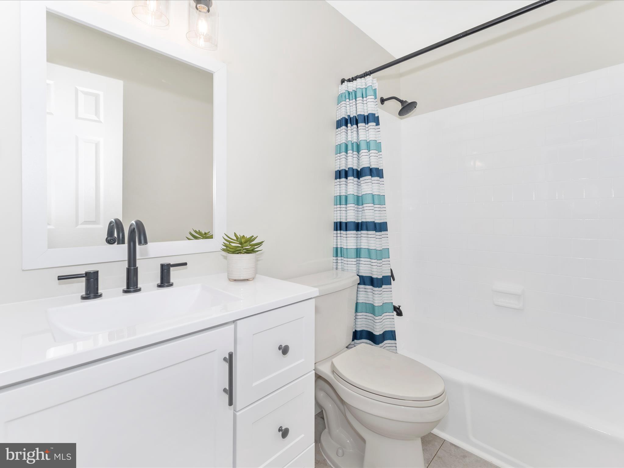 4328 Dover Drive Frederick, MD 21703 - Photo 24 of 54 a bathroom with a sink a toilet and shower