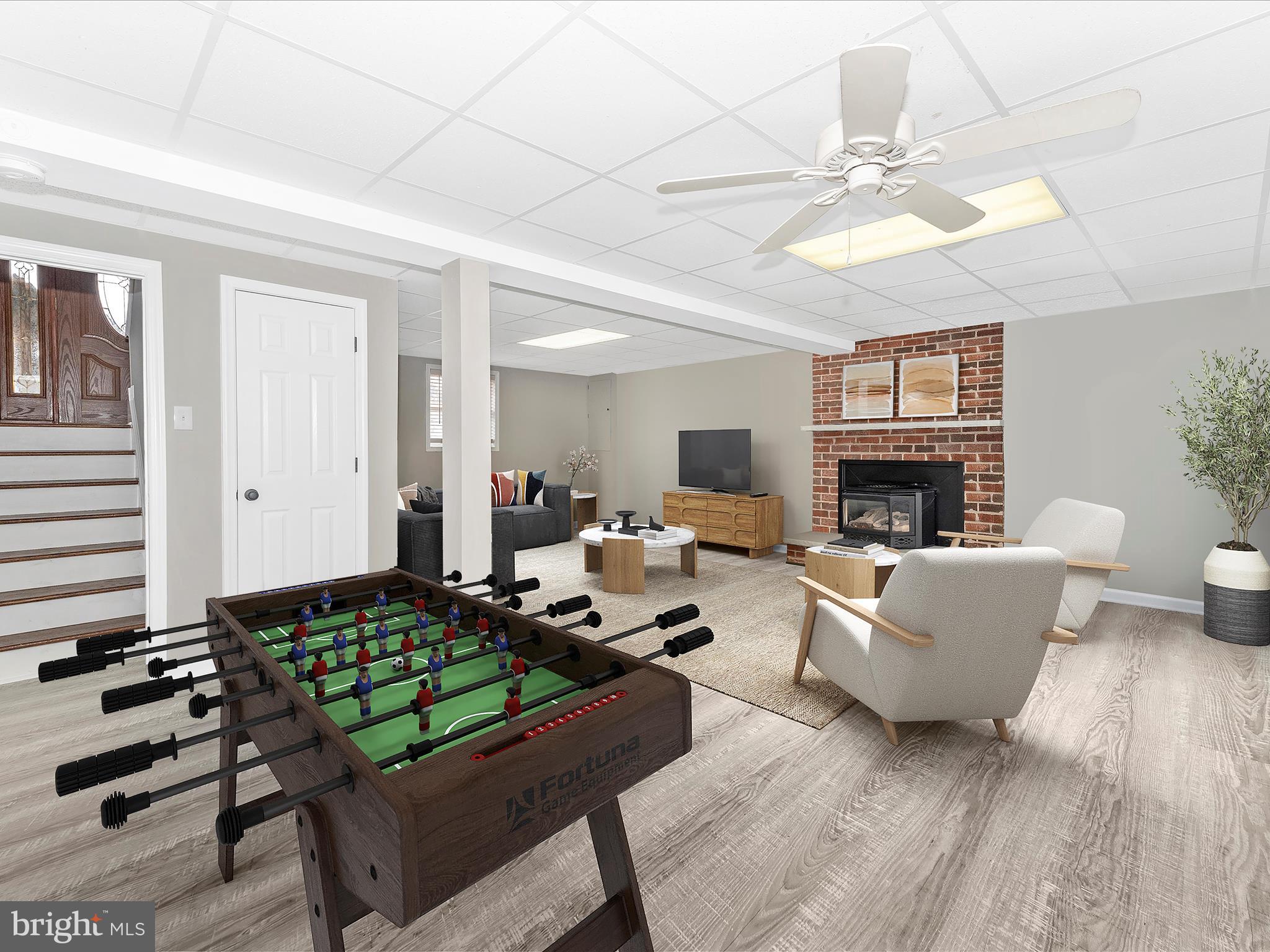 4328 Dover Drive Frederick, MD 21703 - Photo 25 of 54 a living room with furniture and a fireplace