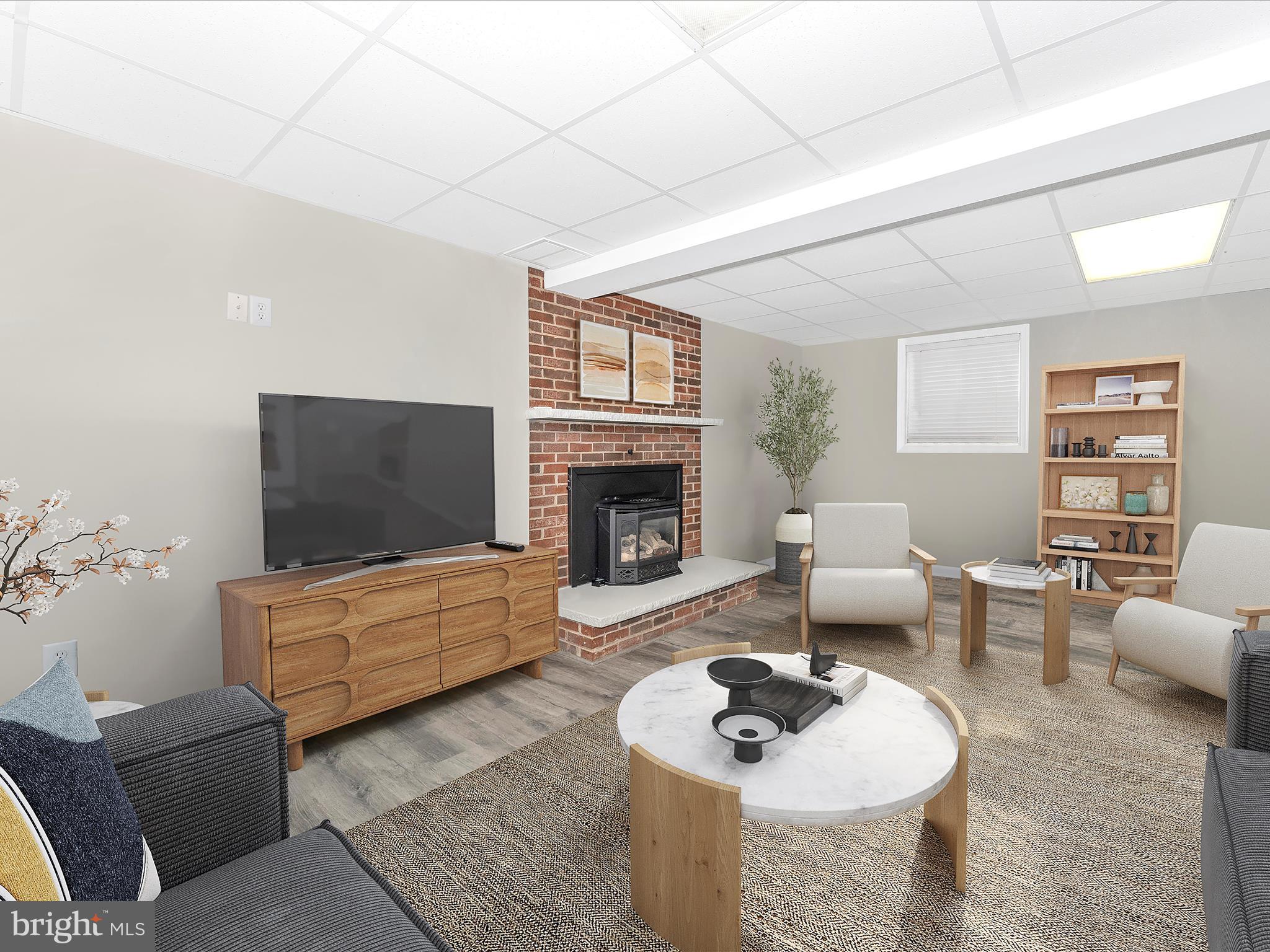 4328 Dover Drive Frederick, MD 21703 - Photo 27 of 54 a living room with furniture and a fireplace