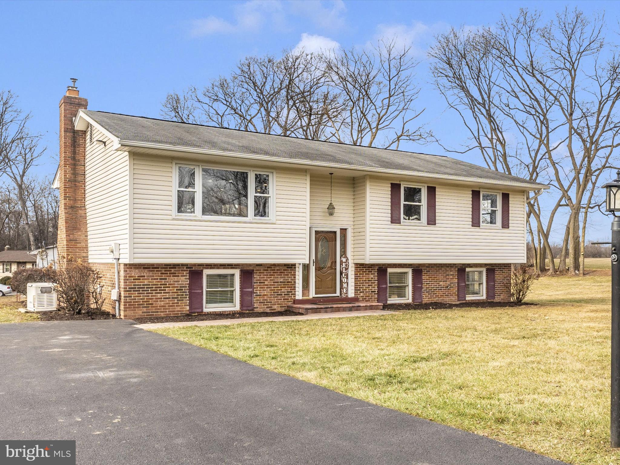 4328 Dover Drive Frederick, MD 21703 - Photo 35 of 54 a front view of a house with a yard