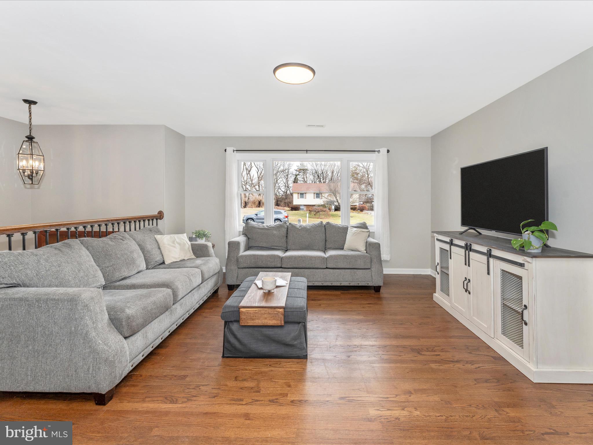 4328 Dover Drive Frederick, MD 21703 - Photo 4 of 54 a living room with furniture and a flat screen tv