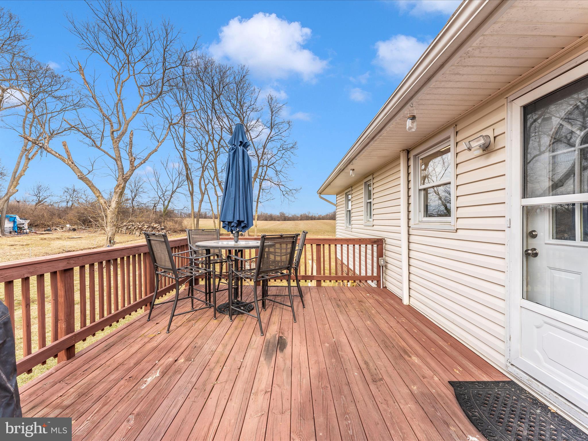 4328 Dover Drive Frederick, MD 21703 - Photo 41 of 54 a view of a roof deck with table and chairs and wooden floor