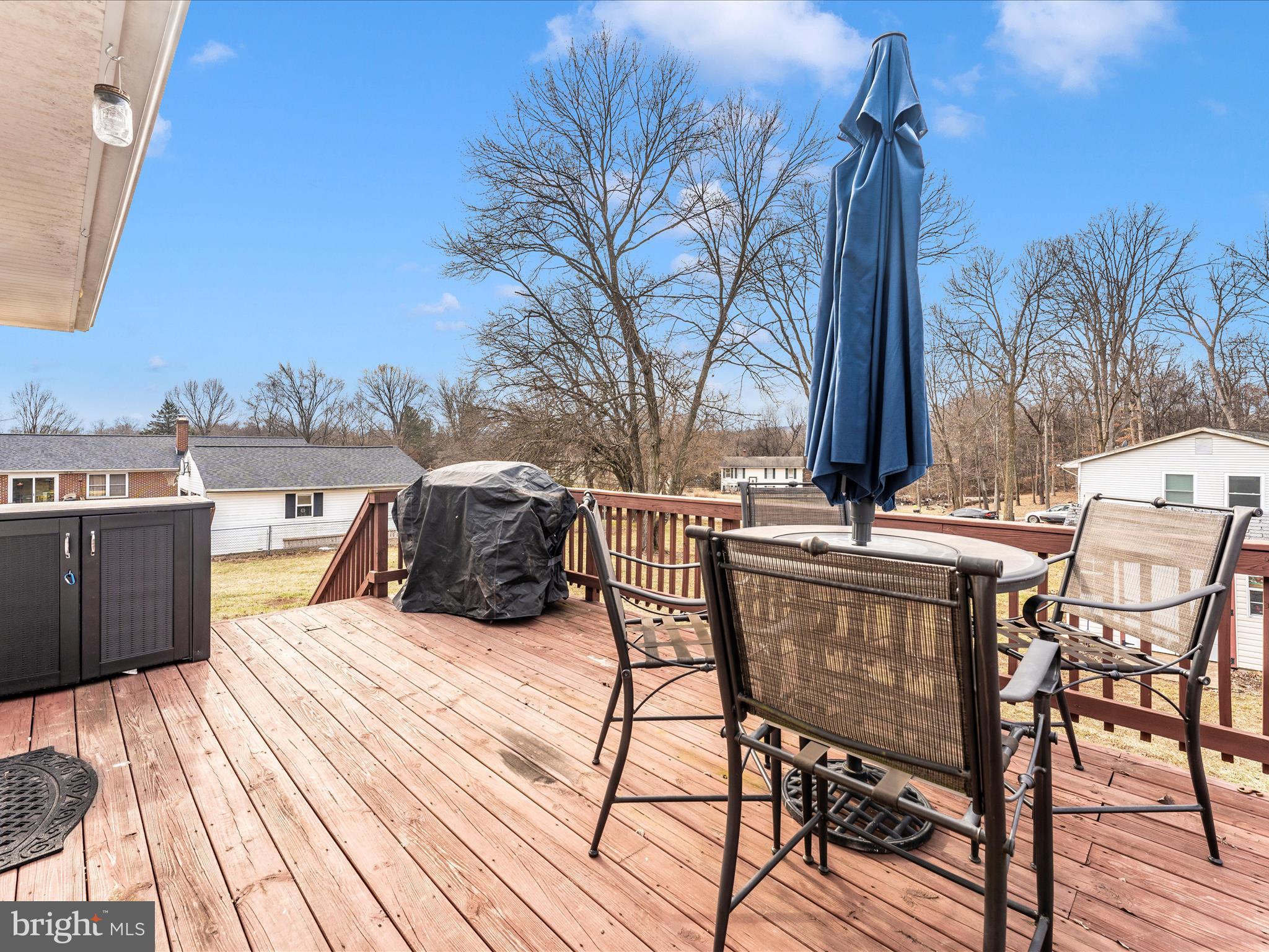 4328 Dover Drive Frederick, MD 21703 - Photo 43 of 54 a view of a chairs and table on the deck