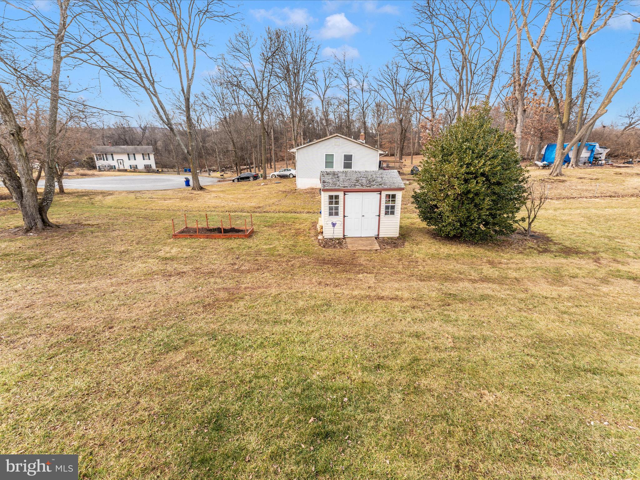 4328 Dover Drive Frederick, MD 21703 - Photo 45 of 54 a view of a yard with yellow house