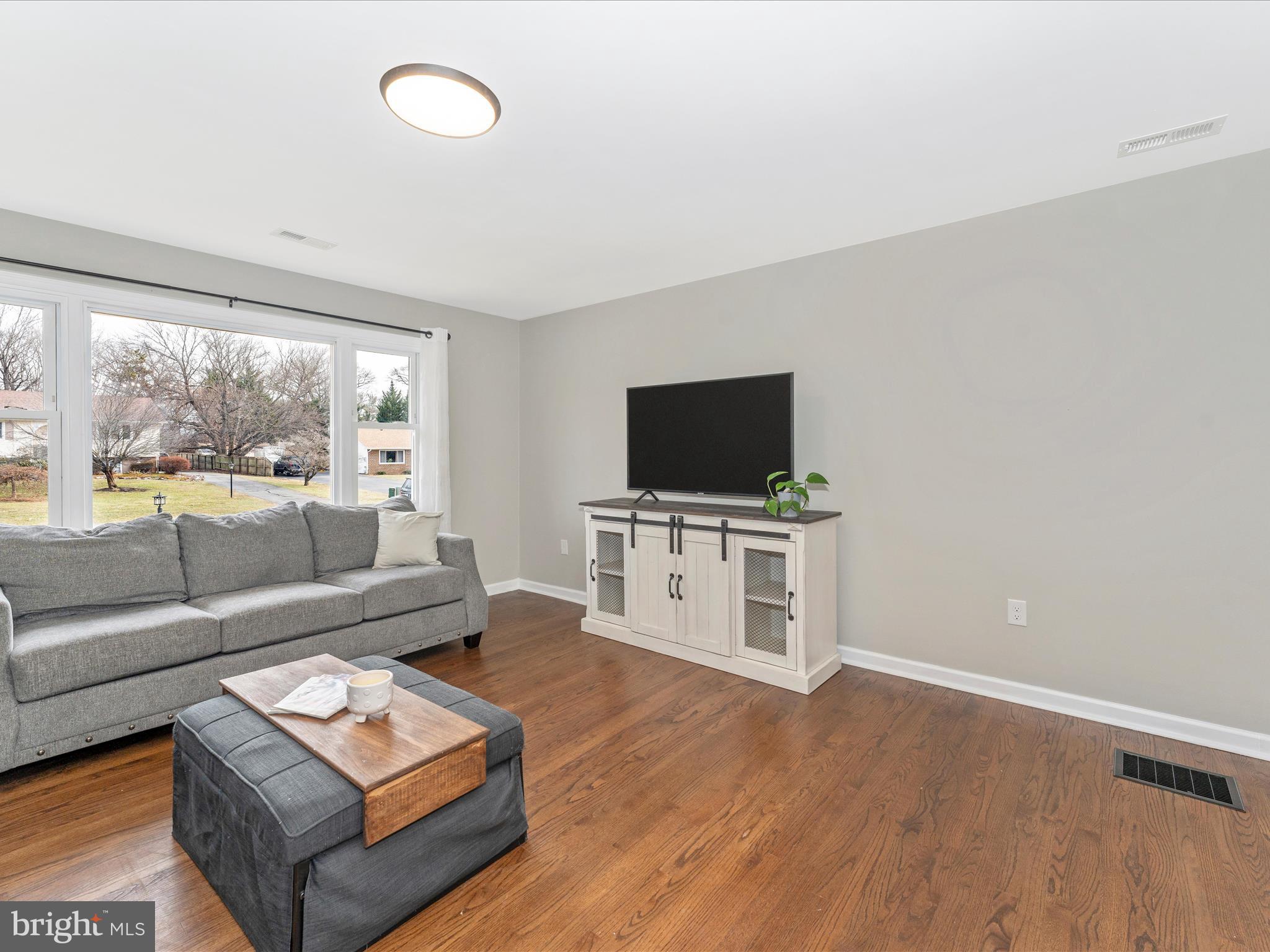 4328 Dover Drive Frederick, MD 21703 - Photo 5 of 54 a living room with furniture and a flat screen tv