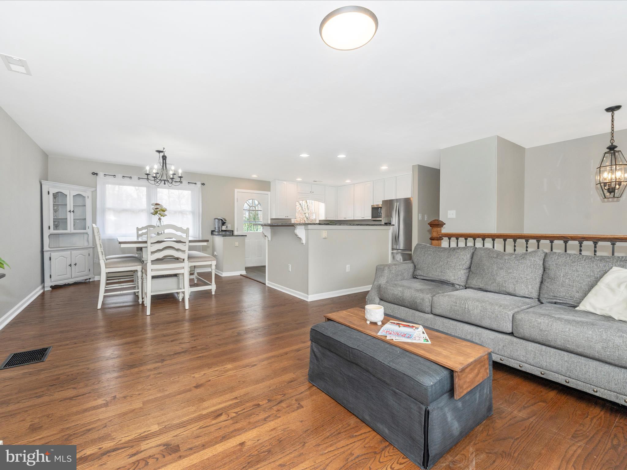4328 Dover Drive Frederick, MD 21703 - Photo 7 of 54 a living room with furniture and wooden floor
