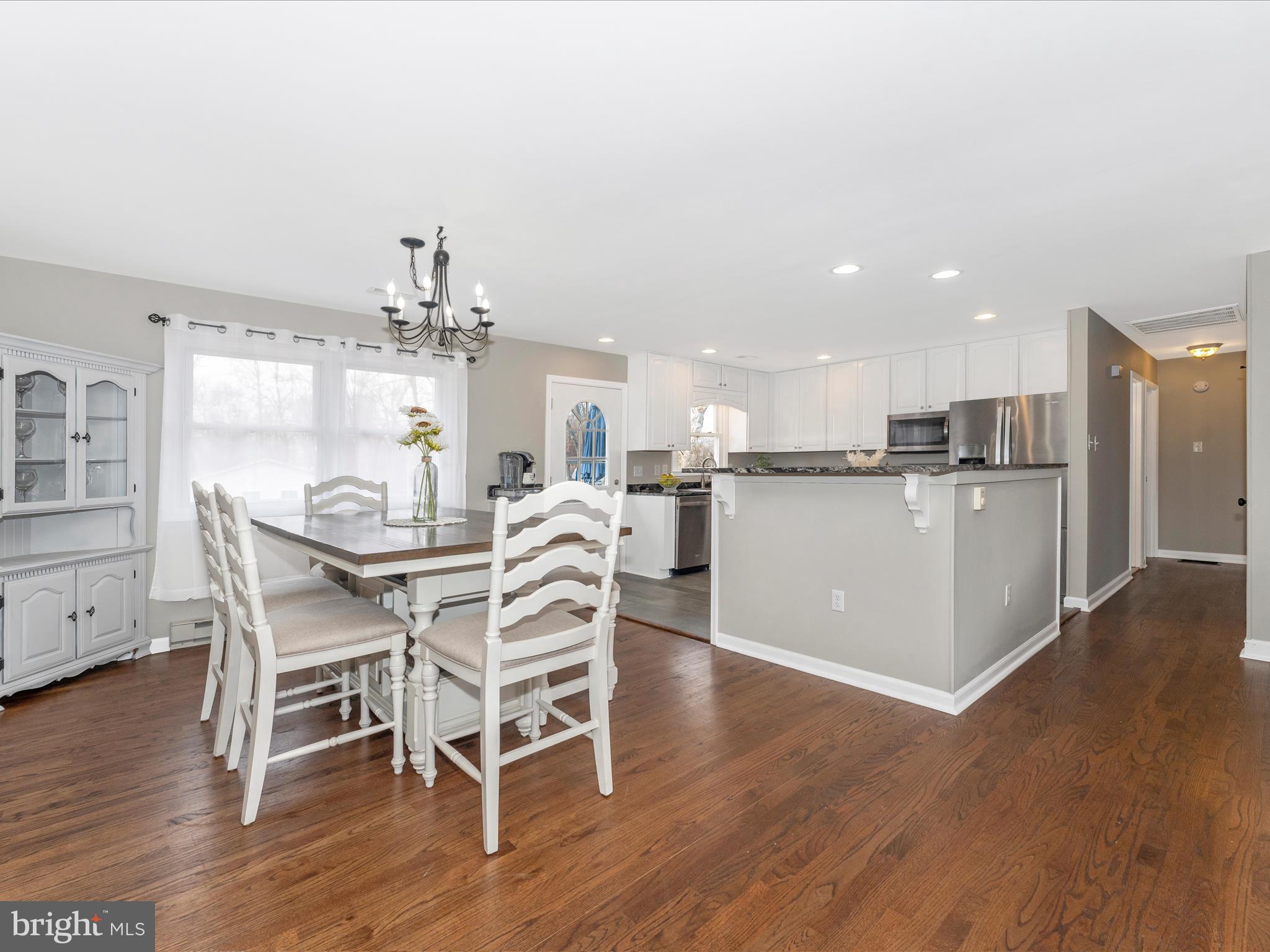 4328 Dover Drive Frederick, MD 21703 - Photo 9 of 54 a dining room with furniture and wooden floor