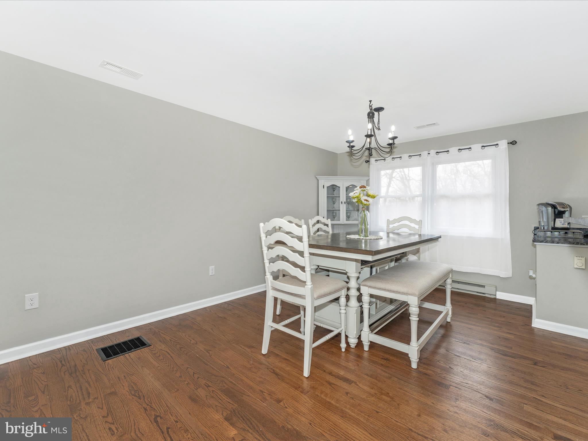 4328 Dover Drive Frederick, MD 21703 - Photo 10 of 54 a dining room with furniture wooden floor and chandelier