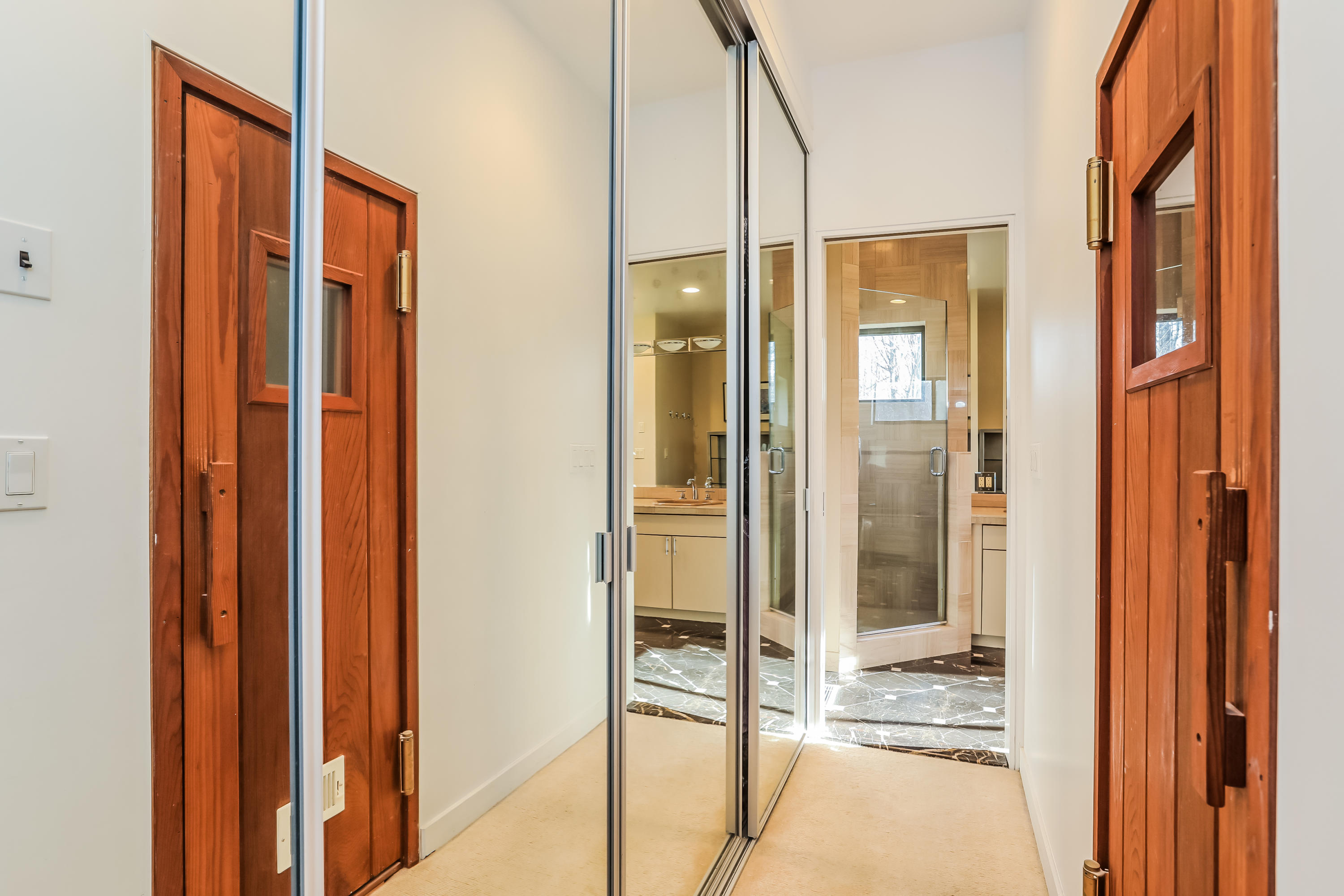 50 Marvin Ridge Place Wilton, CT 06897 - Photo 16 of 32 a bathroom with a glass shower door and a glass door