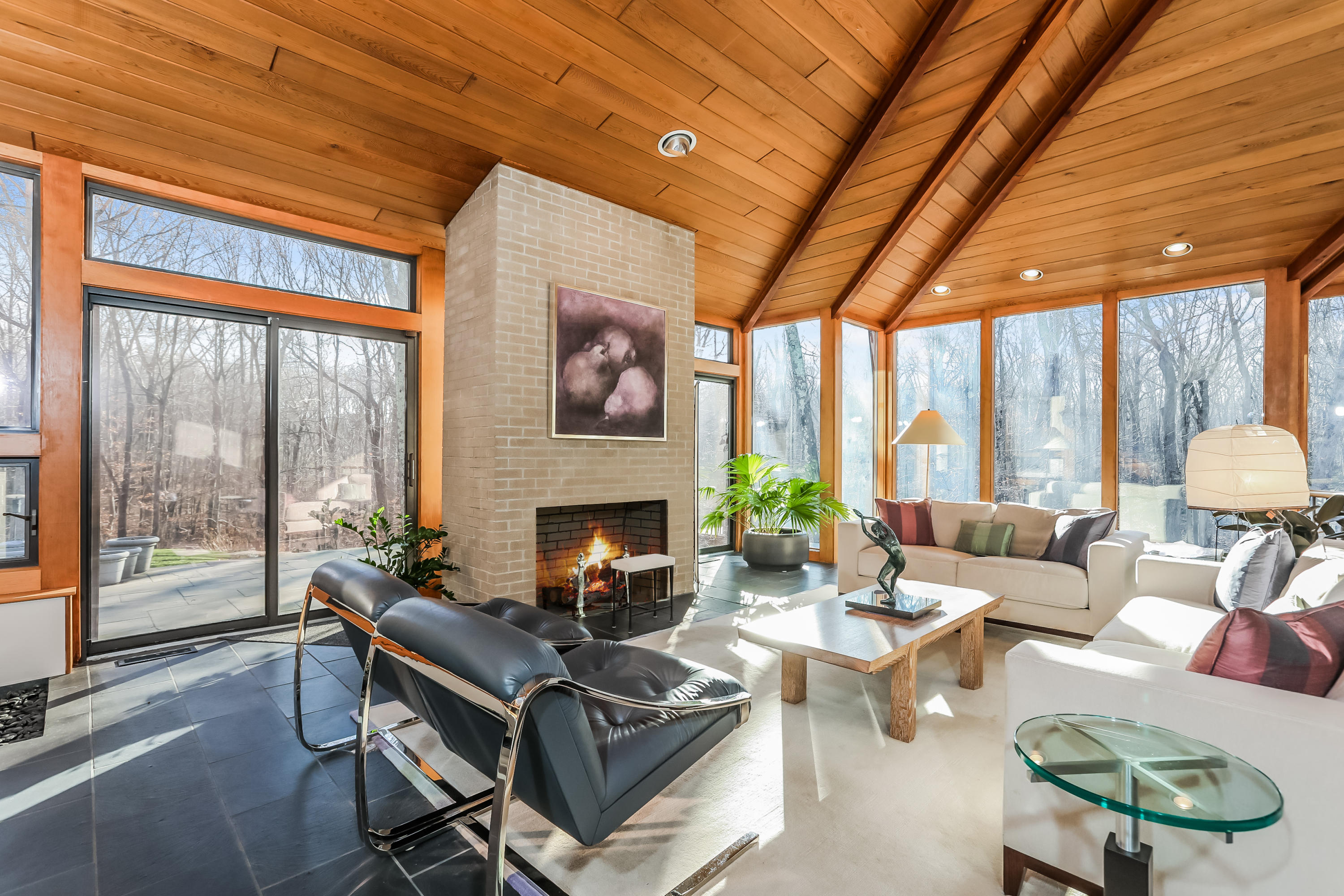 50 Marvin Ridge Place Wilton, CT 06897 - Photo 5 of 32 a living room with furniture a fireplace and a large window