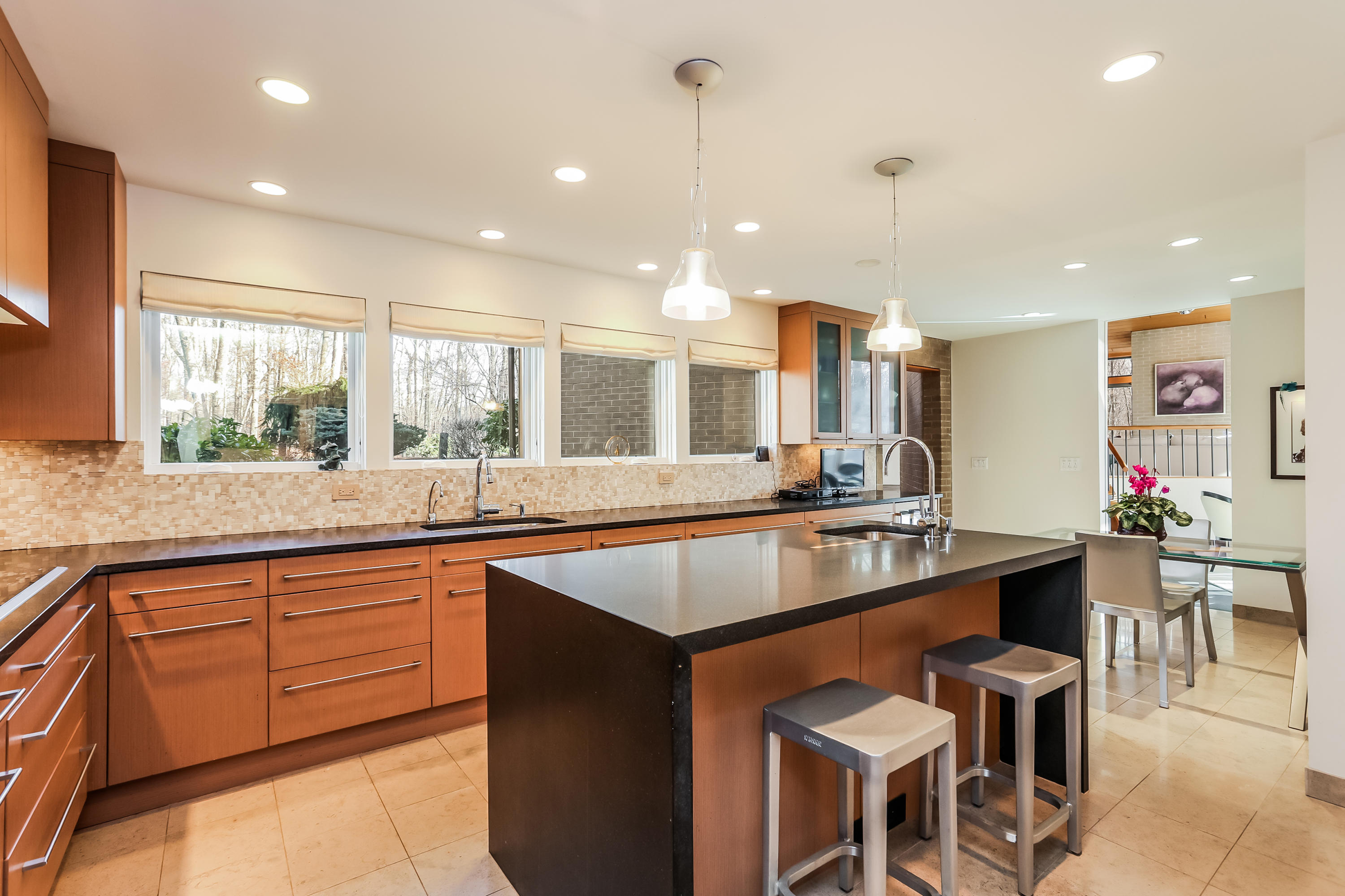 50 Marvin Ridge Place Wilton, CT 06897 - Photo 9 of 32 a kitchen with center island table and chairs