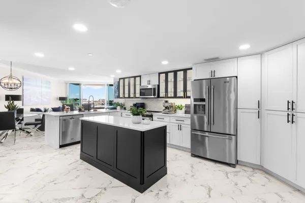 a kitchen with a table and chairs in it