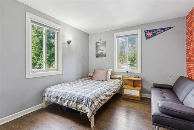 a bedroom with a bed and a couch