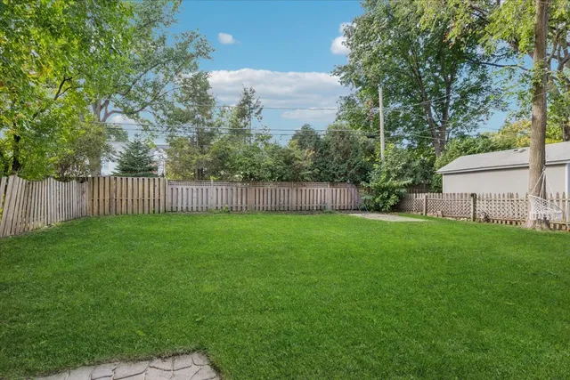 a view of a backyard with a garden