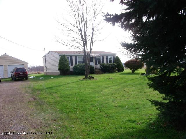 280 J & J Road Moscow, PA 18444 - Photo 1 of 7 a view of a house with a yard
