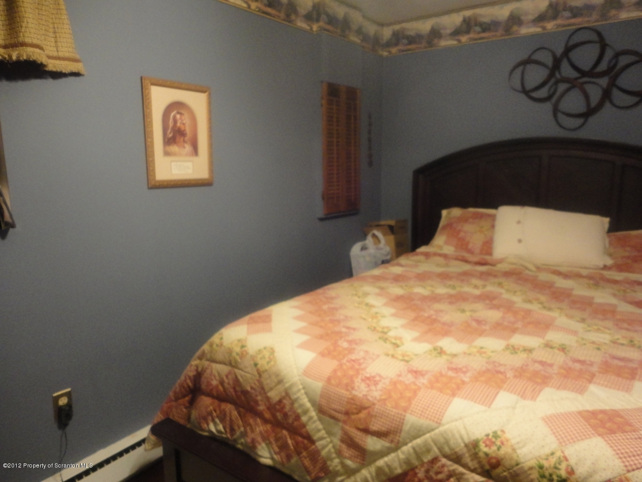 280 J & J Road Moscow, PA 18444 - Photo 5 of 7 a bedroom with a bed and painting on the wall