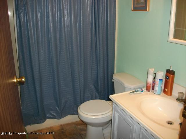 280 J & J Road Moscow, PA 18444 - Photo 6 of 7 a bathroom with a sink a toilet and shower