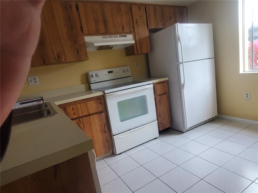 107 Cypress Court, Unit 2C Oldsmar, FL 34677 - Photo 3 of 12 a utility room with dryer and washer