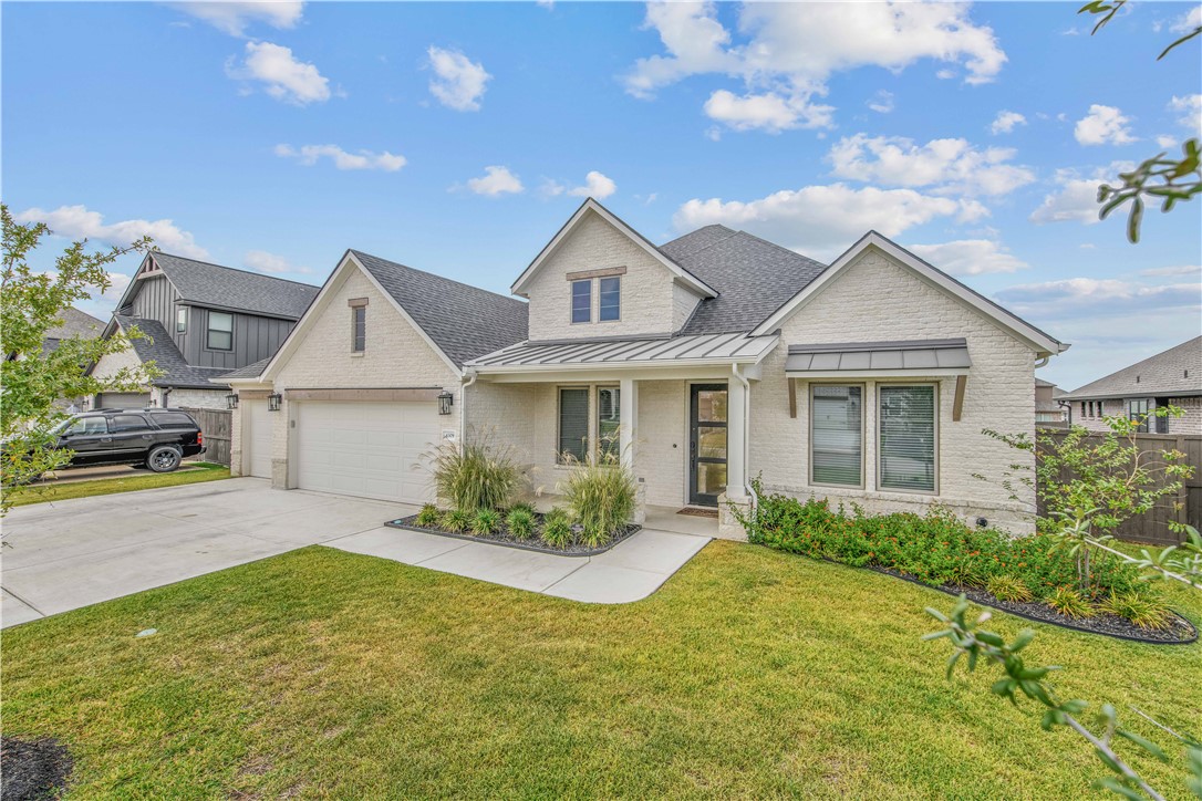 4309 Batona Court Bryan, TX 77802 - Photo 1 of 27 a front view of a house with garden