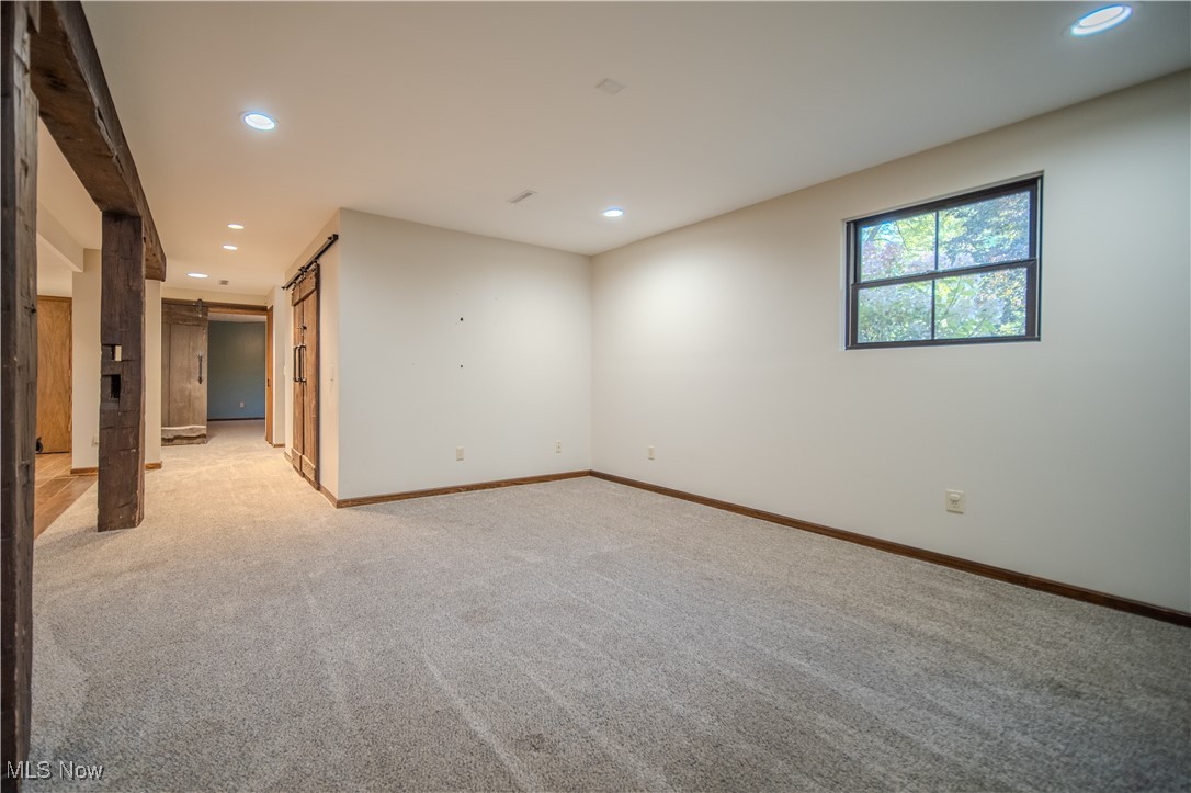 3459 Laubert Road Atwater, OH 44201 - Photo 23 of 39 Spare room featuring recessed lighting, light carpet, and a barn door