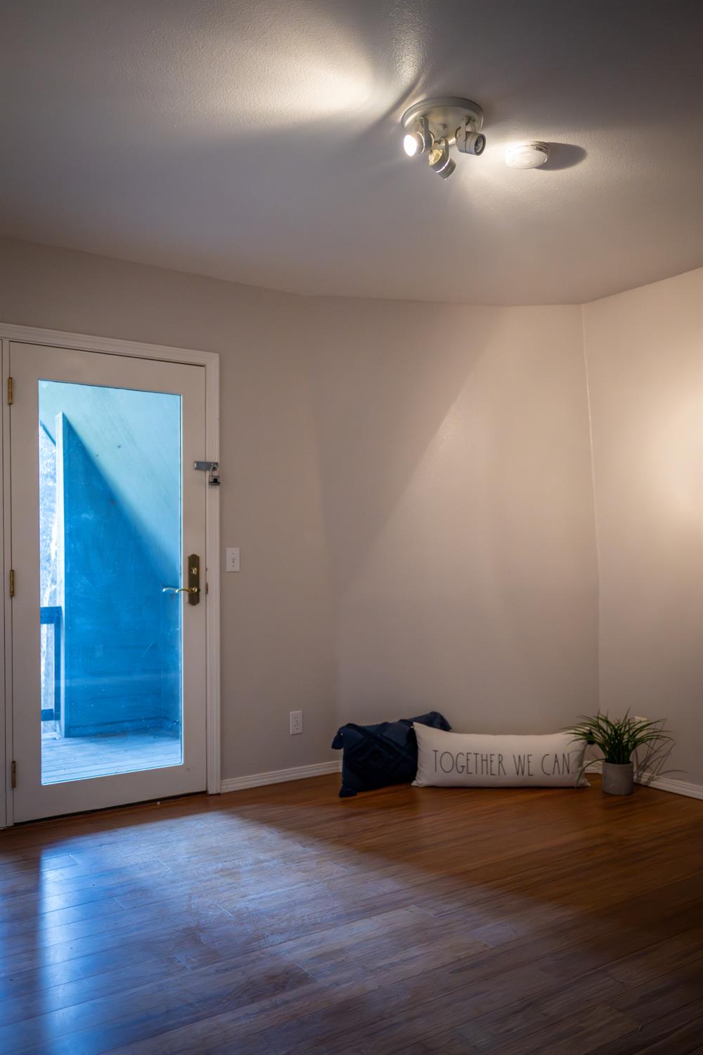 18125 Douglas Road Nevada City, CA 95959 - Photo 13 of 48 a view of an empty room with wooden floor and a window